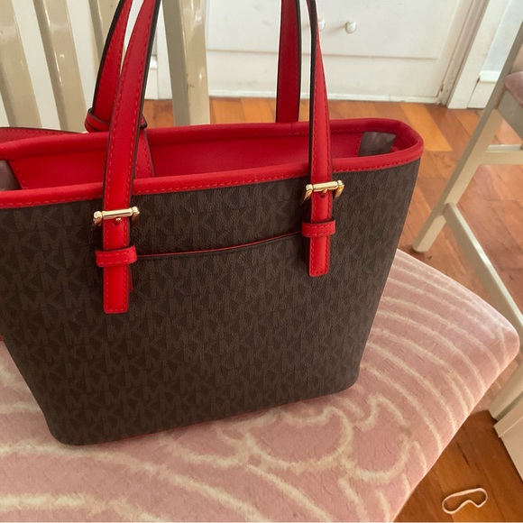 This is the Michael Kors Jet Set Travel Extra-Small Logo Top-Zip Tote Bag. - Picture 3 of 4